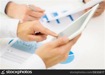 business, people, technology and teamwork concept - close up of businessman hands with tablet pc computer blank screens at office