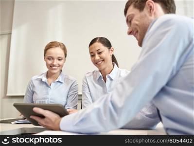 business, people, technology and teamwork concept - smiling businessman and businesswomen with tablet pc computer meeting in office