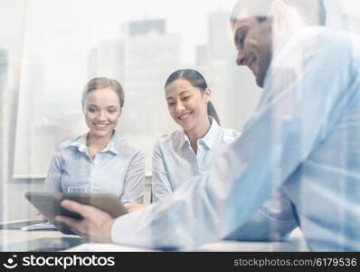 business, people, technology and teamwork concept - smiling businessman and businesswomen with tablet pc computer meeting in office