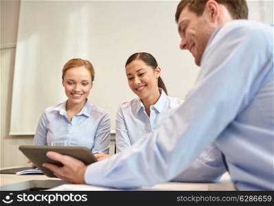 business, people, technology and teamwork concept - smiling businessman and businesswomen with tablet pc computer meeting in office