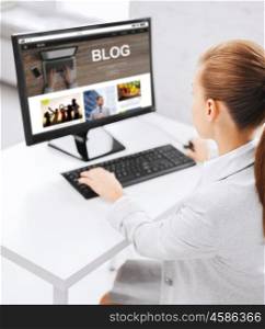 business, people, technology, blogging and education concept - businesswoman or student girl with internet blog page on computer screen sitting at office table. businesswoman with computer blogging at office