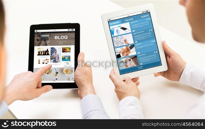 business, people, technology, blogging and mass media concept - close up of businessman hands with internet blog and news web page on tablet pc computer screens at office