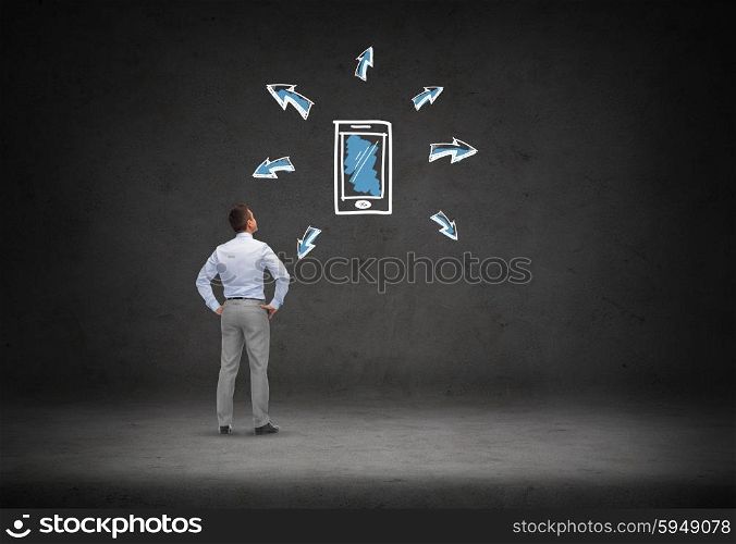 business, people, technology, communication and connection concept - businessman looking smartphone doodle with arrows over concrete room background from back