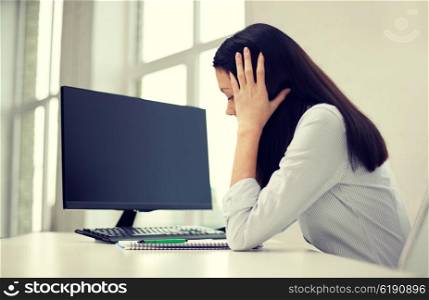 business, people, technology, crisis and education concept - close up of sad woman with computer black blank monitor and notebook sitting at table in office