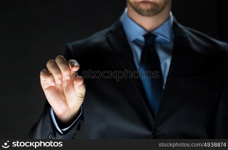 business, people, technology, cyberspace and office concept - close up of businessman in suit working with invisible virtual reality screen. close up of businessman touching virtual screen