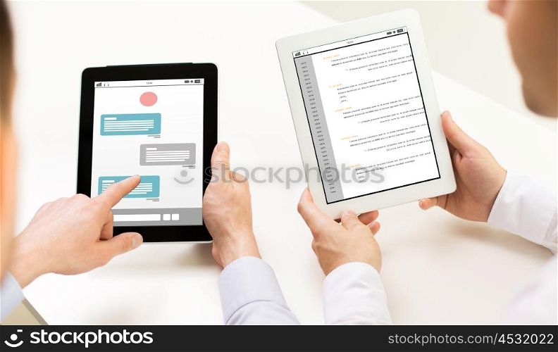 business, people, technology, online communication and programming concept - close up of businessman hands with messenger and coding on tablet pc computer screens at office