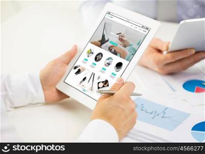 business, people, technology, online shopping and teamwork concept - close up of businessman hands with internet shop page on tablet pc computer screen at office
