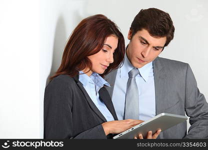 Business people using electronic tab