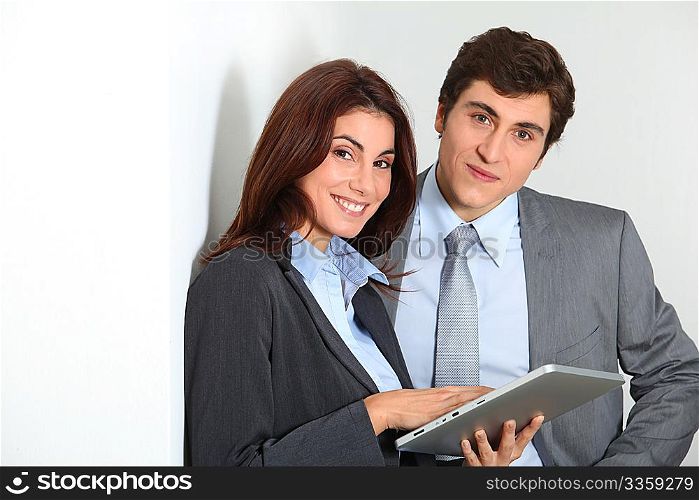 Business people using electronic tab