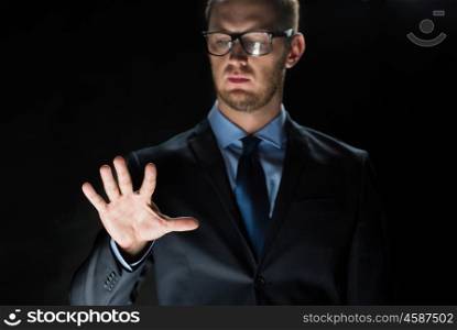 business, people, virtual reality, technology and cyberspace concept - close up of businessman in suit working with something invisible
