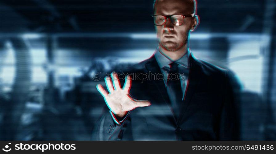 business, people, virtual reality, technology and cyberspace concept - close up of businessman in suit working with something invisible over abstract background. close up of businessman with something invisible. close up of businessman with something invisible