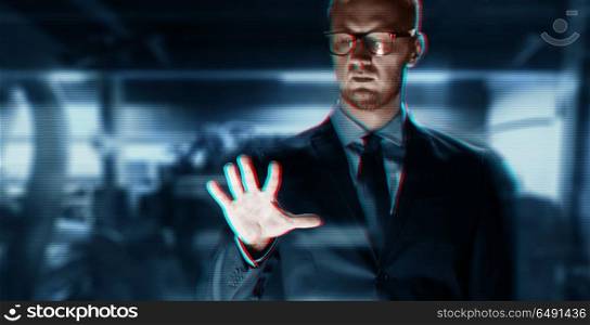 business, people, virtual reality, technology and cyberspace concept - close up of businessman in suit working with something invisible over abstract background. close up of businessman with something invisible. close up of businessman with something invisible
