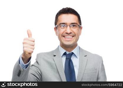business, people, vision and office concept - happy smiling businessman in eyeglasses and suit showing thumbs up