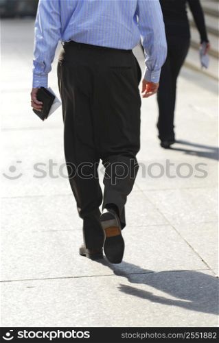 Business people walking on a busy street downtown