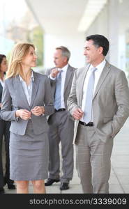 Business people walking outside a congress center