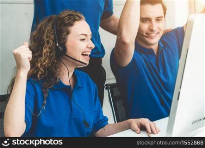 Business people wearing headset celebrate working in office . Call center, telemarketing, customer support agent provide service on telephone video conference call.