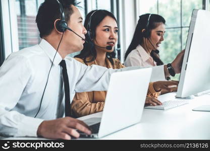 Business people wearing headset working actively in office . Call center, telemarketing, customer support agent provide service on telephone video conference call.. Business people wearing headset working actively in office