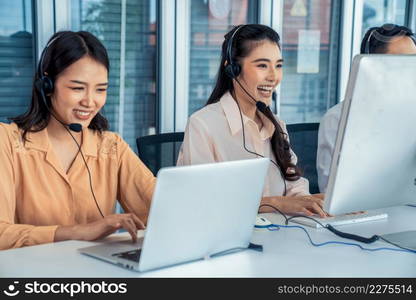 Business people wearing headset working actively in office . Call center, telemarketing, customer support agent provide service on telephone video conference call.. Business people wearing headset working actively in office