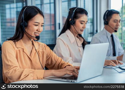 Business people wearing headset working actively in office . Call center, telemarketing, customer support agent provide service on telephone video conference call.. Business people wearing headset working actively in office