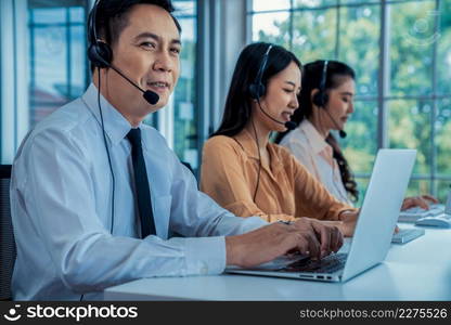 Business people wearing headset working actively in office . Call center, telemarketing, customer support agent provide service on telephone video conference call.. Business people wearing headset working actively in office