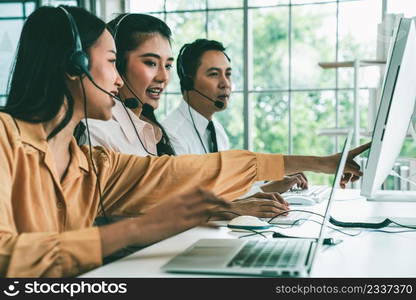 Business people wearing headset working actively in office . Call center, telemarketing, customer support agent provide service on telephone video conference call.. Business people wearing headset working actively in office