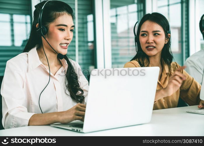 Business people wearing headset working actively in office . Call center, telemarketing, customer support agent provide service on telephone video conference call.. Business people wearing headset working actively in office