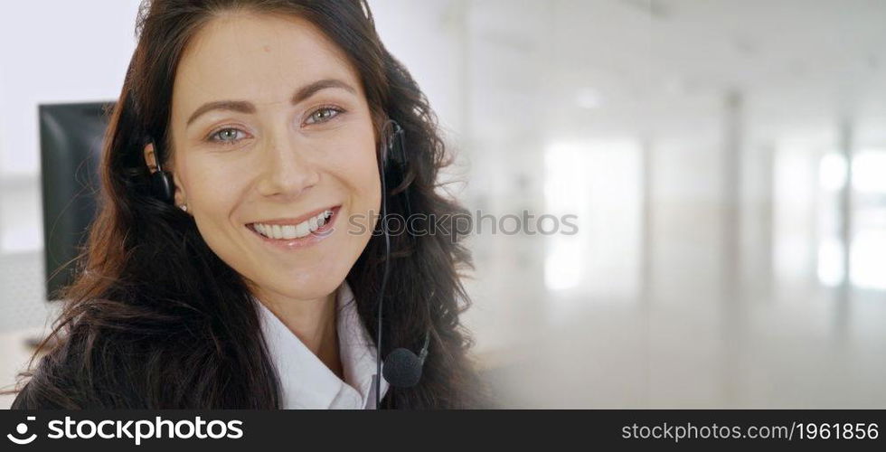 Business people wearing headset working in office to support remote customer or colleague. Call center, telemarketing, customer support agent provide service in broaden view .. Business people wearing headset working in office broaden view