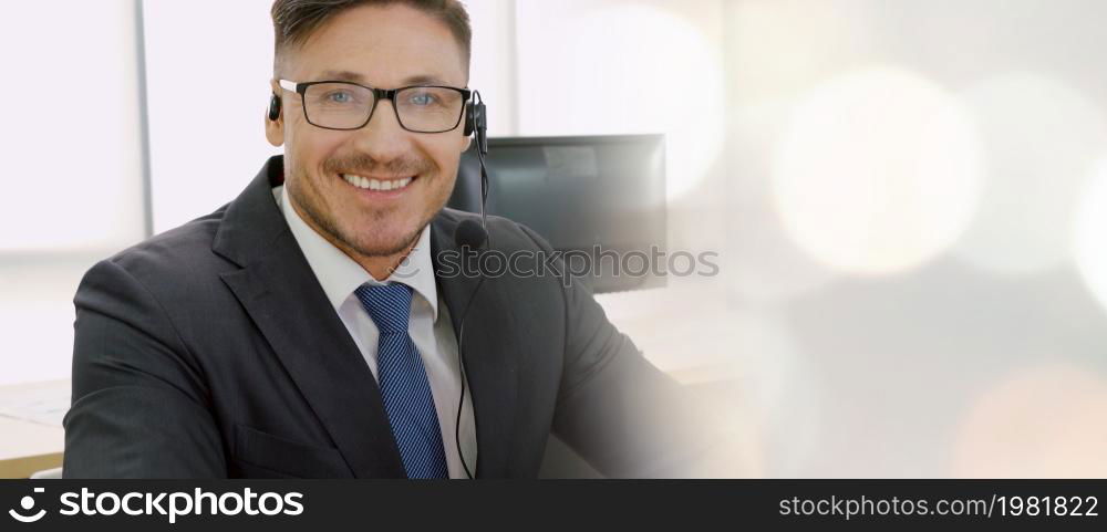 Business people wearing headset working in office to support remote customer or colleague. Call center, telemarketing, customer support agent provide service in broaden view .. Business people wearing headset working in office broaden view