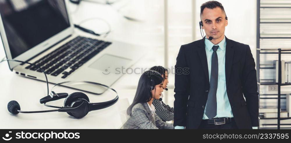 Business people wearing headset working in office to support remote customer or colleague. Call center, telemarketing, customer support agent provide service in broaden view .. Business people wearing headset working in office broaden view