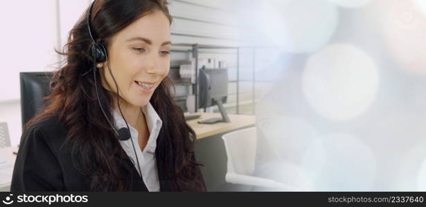 Business people wearing headset working in office to support remote customer or colleague. Call center, telemarketing, customer support agent provide service in broaden view .. Business people wearing headset working in office broaden view