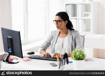 business, people, work and technology concept - businesswoman with computer working at office. businesswoman with computer working at office. businesswoman with computer working at office