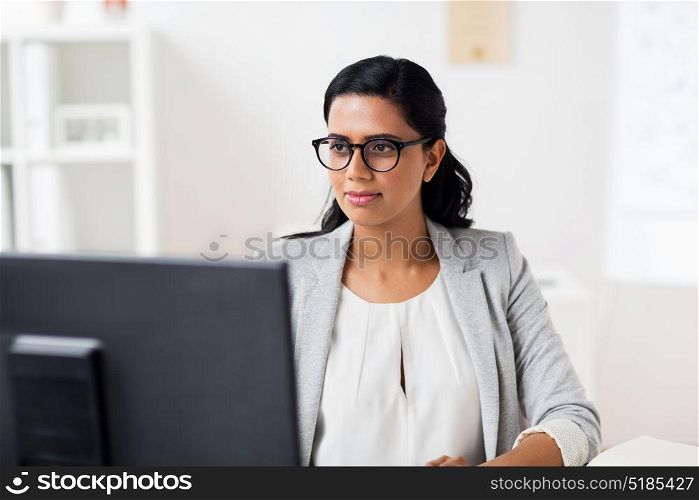 business, people, work and technology concept - businesswoman with computer working at office. businesswoman with computer working at office