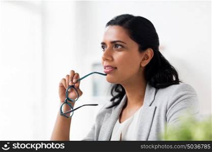 business, people, work and vision concept - businesswoman with glasses at office. businesswoman with glasses at office