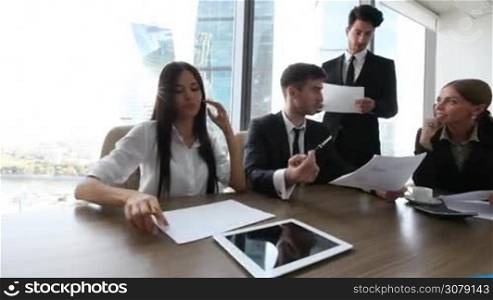 Business people work with documents in office