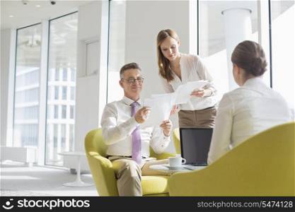 Business people working at office lobby