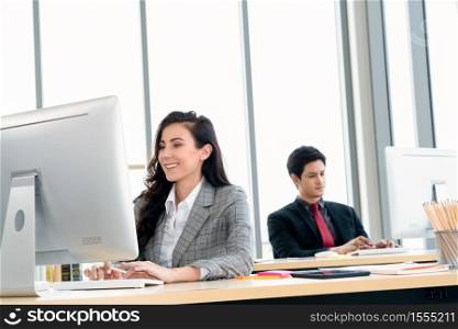 Business people working at table in modern office room while analyzing financial data report .