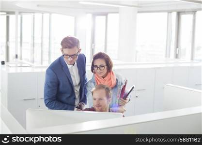 Business people working on computer in creative office