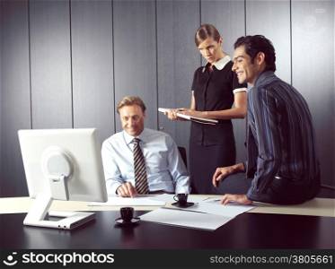 Business people working on computer in office