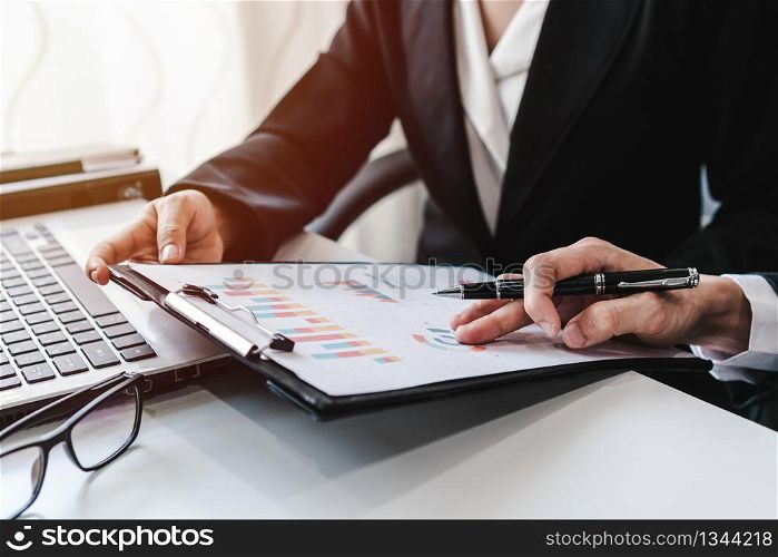 Business people working on Desk office with marketing graph statistics analysis
