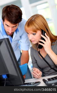 Business people working on desktop computer