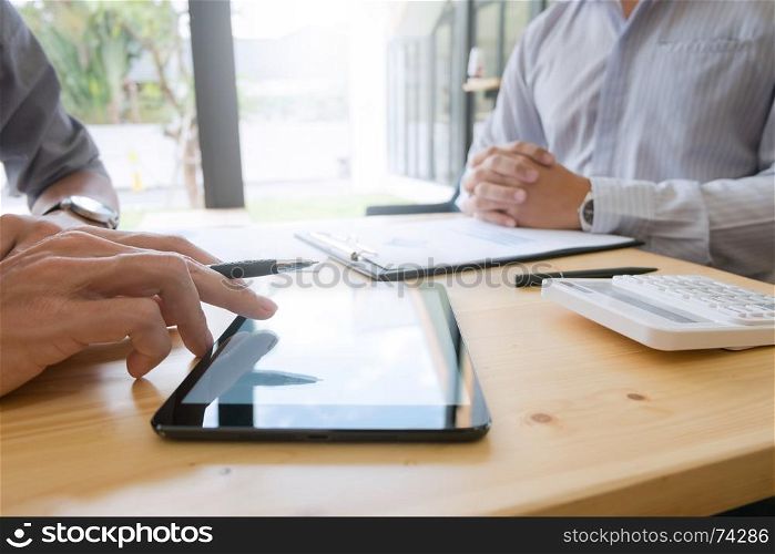 Business people working together and using tablet at a modern office