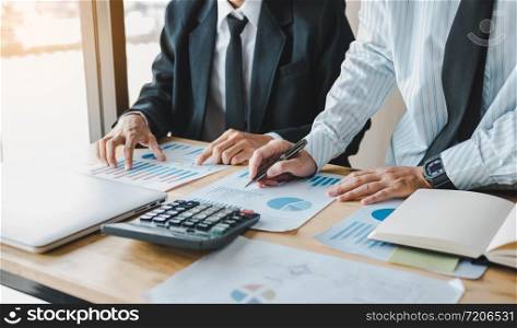 Business people working together at office room table and balancing budget.