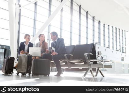 Business people working while waiting for boarding in the airport