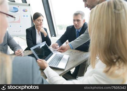 Business people working with laptop at office boardroom meeting. Business people at office meeting