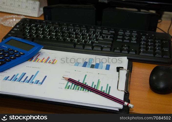 Business performance analysis. Business Graphs with Keyboard, pen.