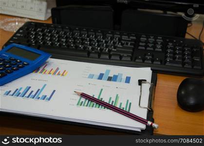 Business performance analysis. Business Graphs with Keyboard, pen.