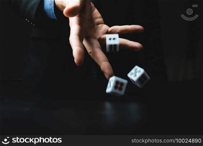 business person hand throw the dice, business gambling game concept