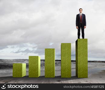 Business person on a graph, representing success and growth