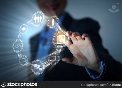 Business person pushing symbols on a touch screen interface