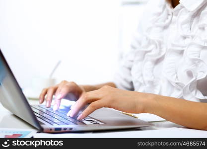 Business person working on computer against technology background